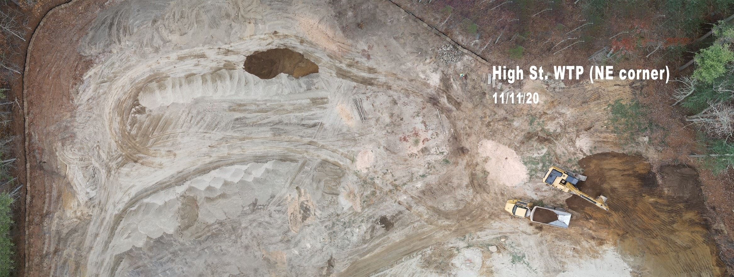 of Topsoil and Fill Material from NW Corner of Site and Trucking to Stockpile